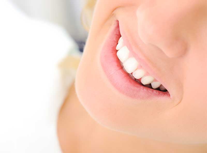 A woman smiling.